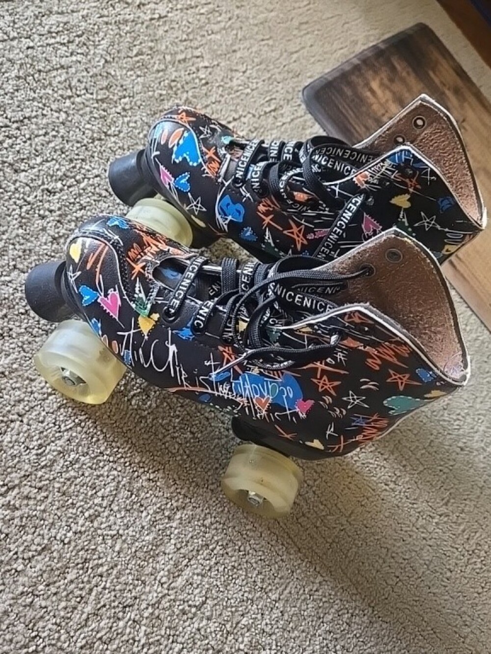 Black Graphic Quad Roller Skates with Colorful Art Works
